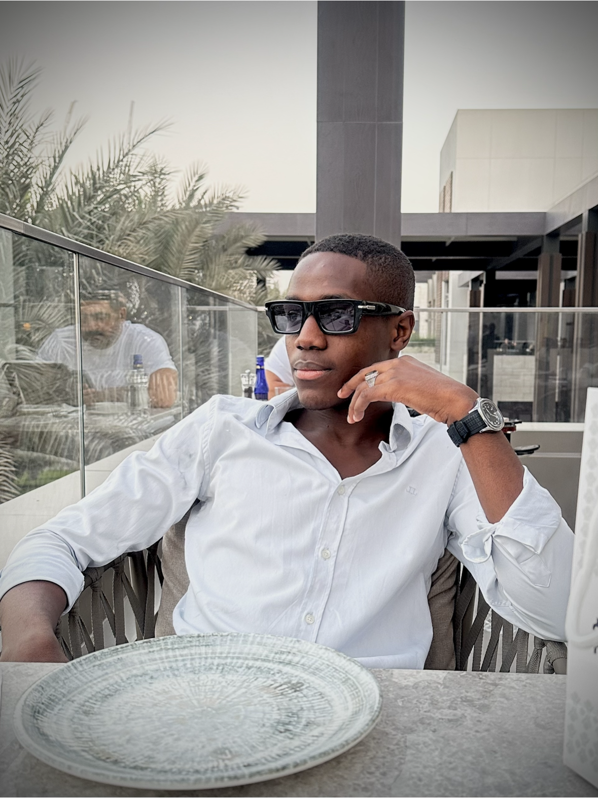 Muhammad Musa Dining in a Restaurant