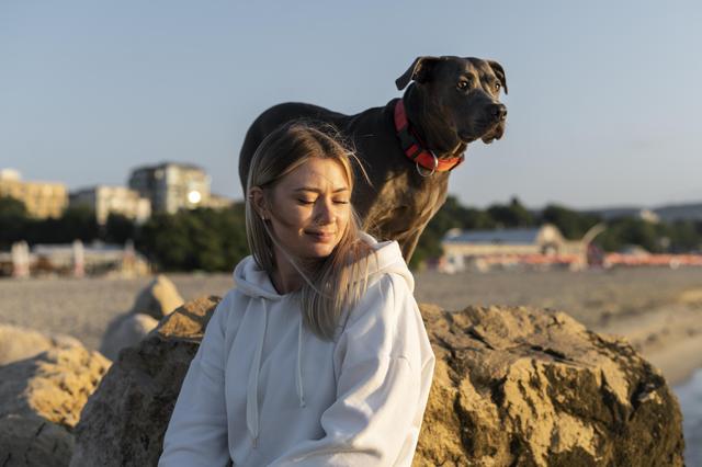 young-woman-enjoying-some-time-with-her-dog.jpg