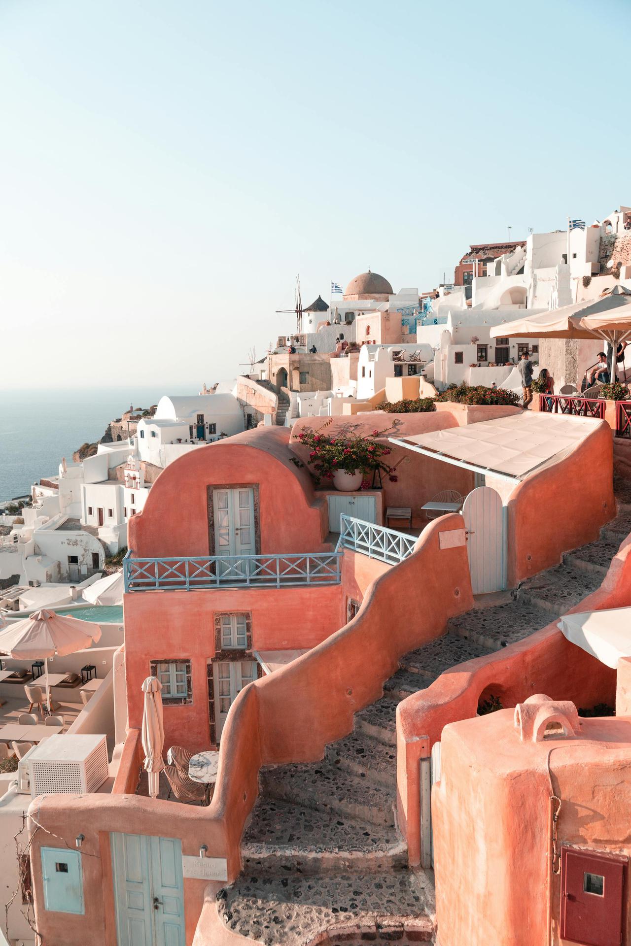 Explore the stunning whitewashed buildings of Santorini, Greece.