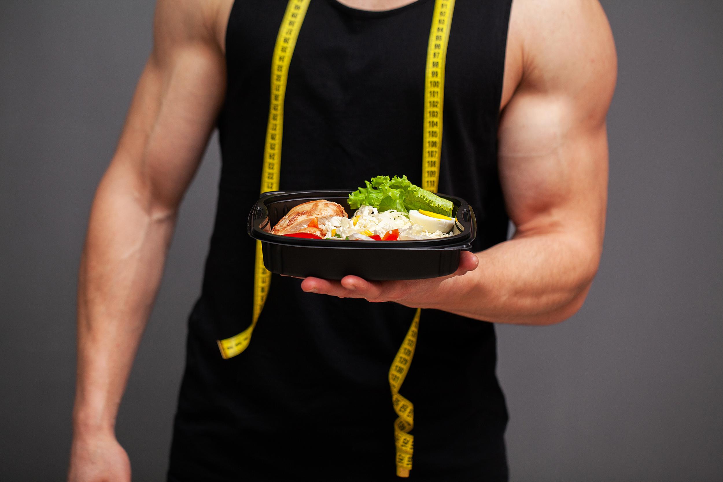 Fit man serving a healthy meal