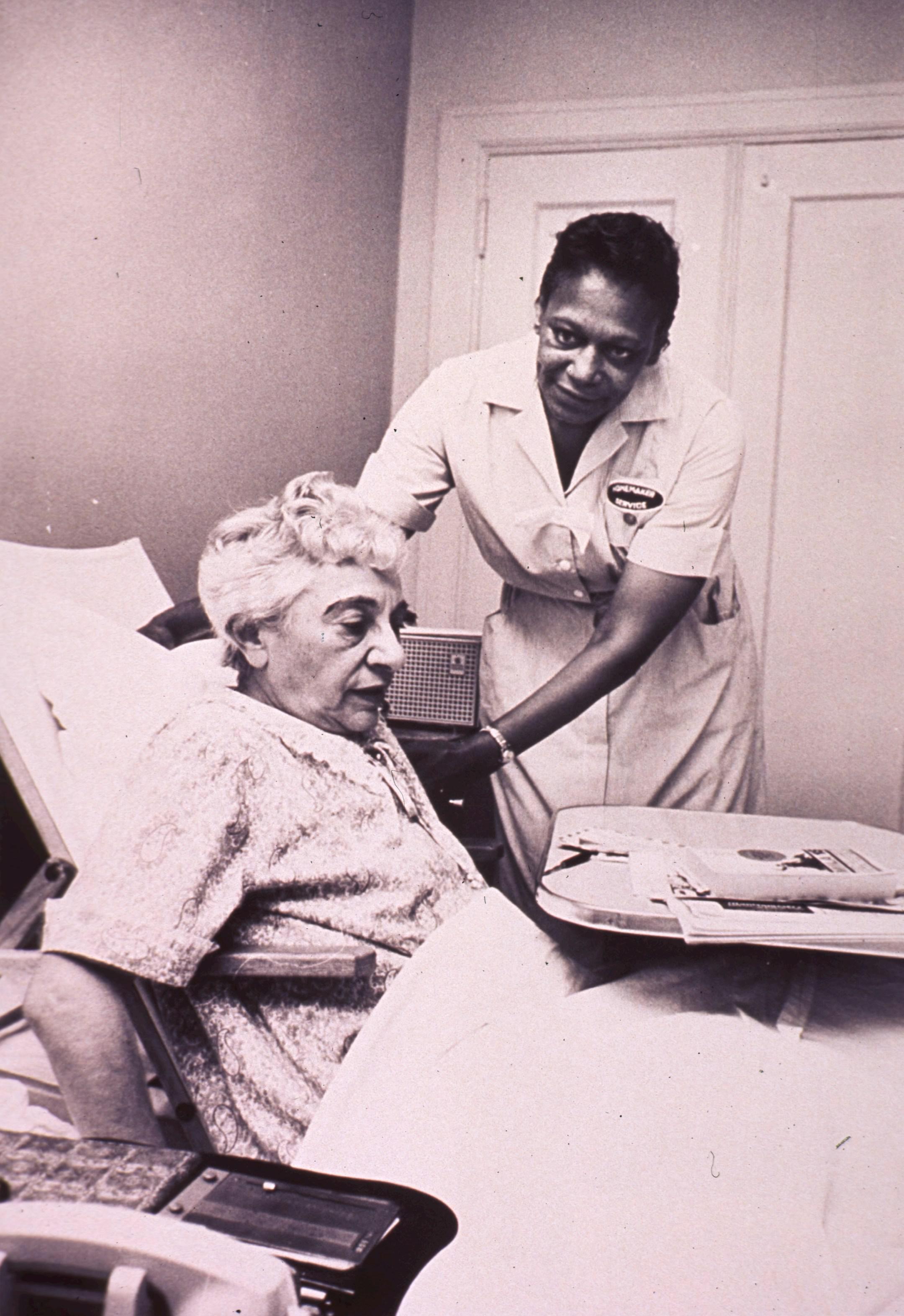 An African American homemaker is helping an invalid woman. Format: Still image Subject(s): Aged, African Americans Genre(s): Pictorial Works Abstract: An African American homemaker is helping an invalid woman. Extent: 1 photographic print : 26 x 21 cm. Technique: black and white NLM Unique ID: 101448557 NLM Image ID: A029681 Permanent Link: resource.nlm.nih.gov/101448557