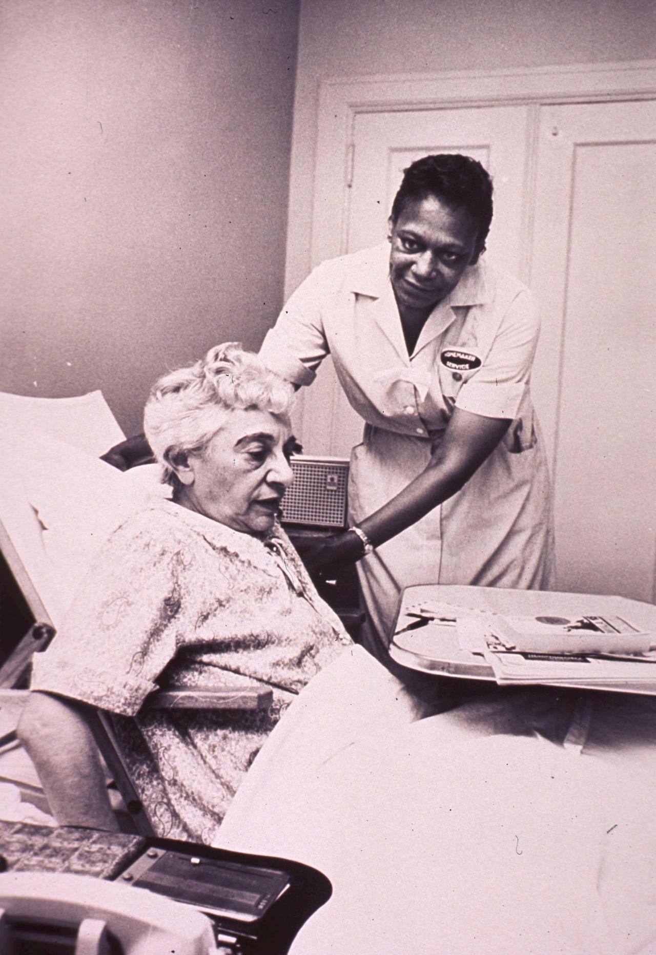 An African American homemaker is helping an invalid woman. Format: Still image Subject(s): Aged, African Americans Genre(s): Pictorial Works Abstract: An African American homemaker is helping an invalid woman. Extent: 1 photographic print : 26 x 21 cm. Technique: black and white NLM Unique ID: 101448557 NLM Image ID: A029681 Permanent Link: resource.nlm.nih.gov/101448557