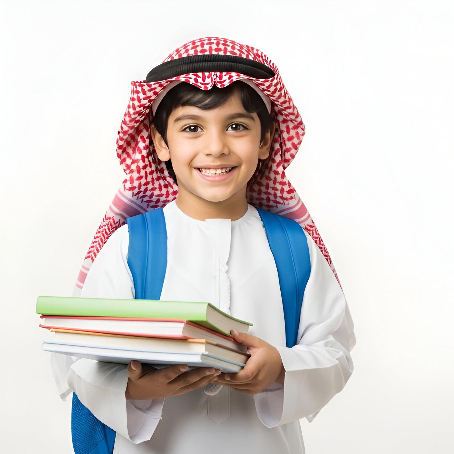arab boy with books wearing traditional attire.jpg