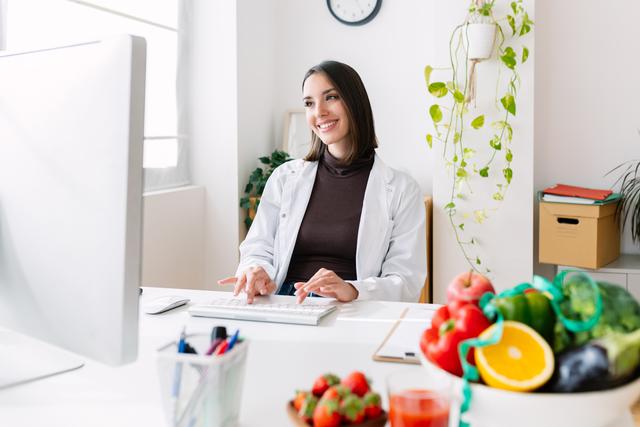 happy-young-female-dietitian-doctor-working-at-med-2023-10-31-03-34-25-utc.jpg