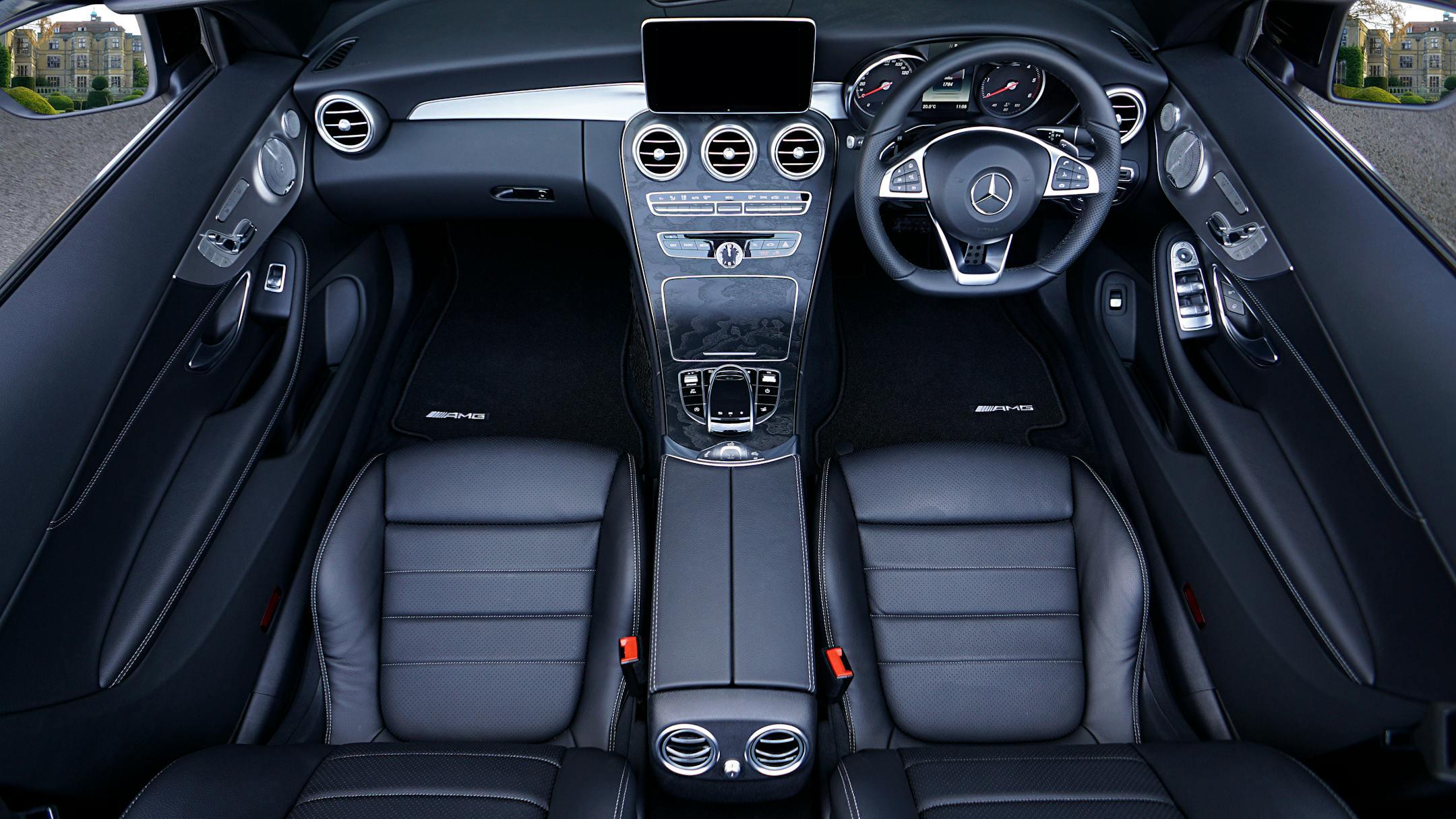 Explore a sleek and stylish Mercedes interior with premium leather seats and sophisticated dashboard.