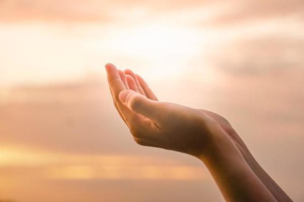 hands-placed-together-like-praying-in-front-of-nature-background-free-photo.jpg