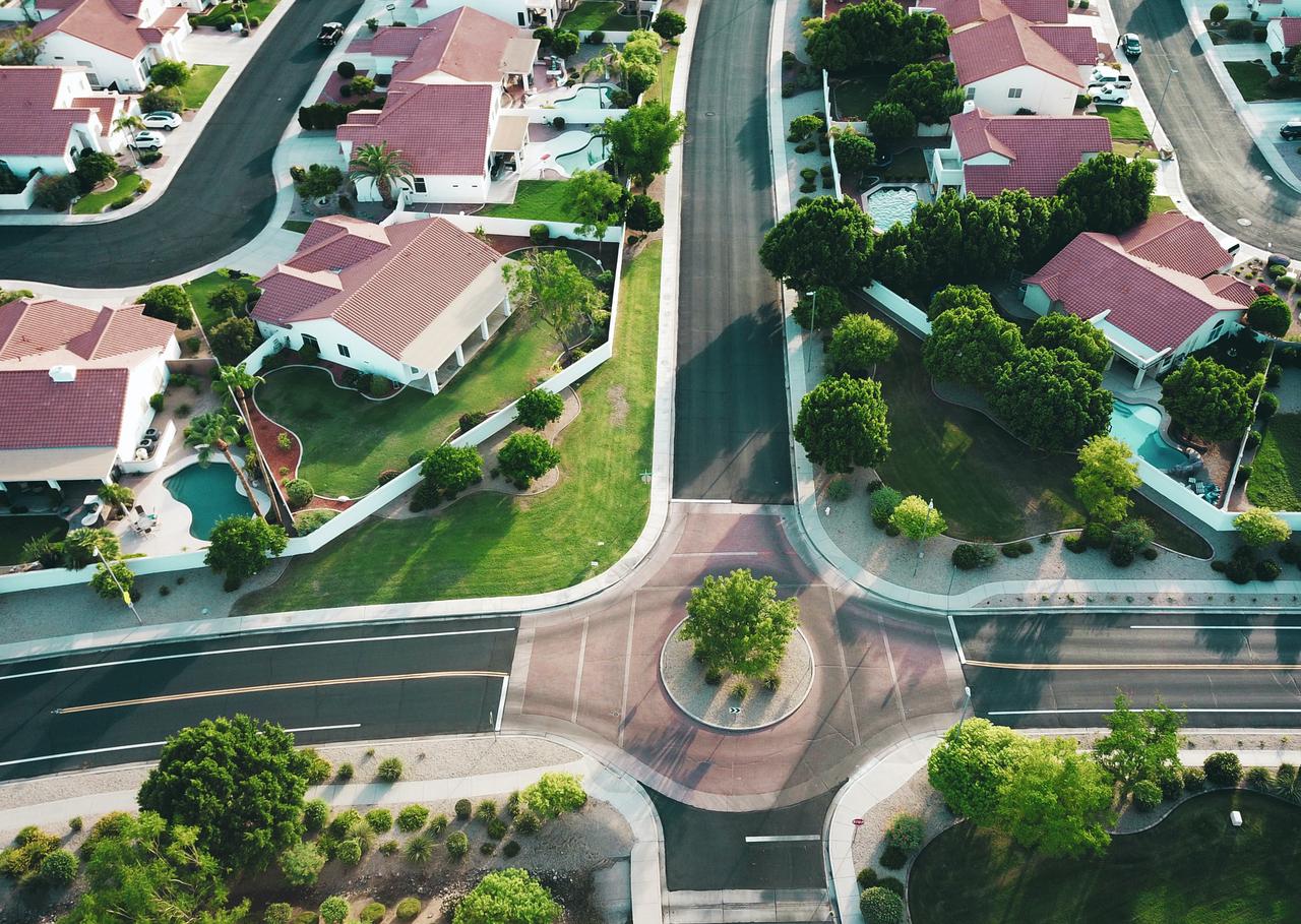 Drone shot looking forward in a suburb.