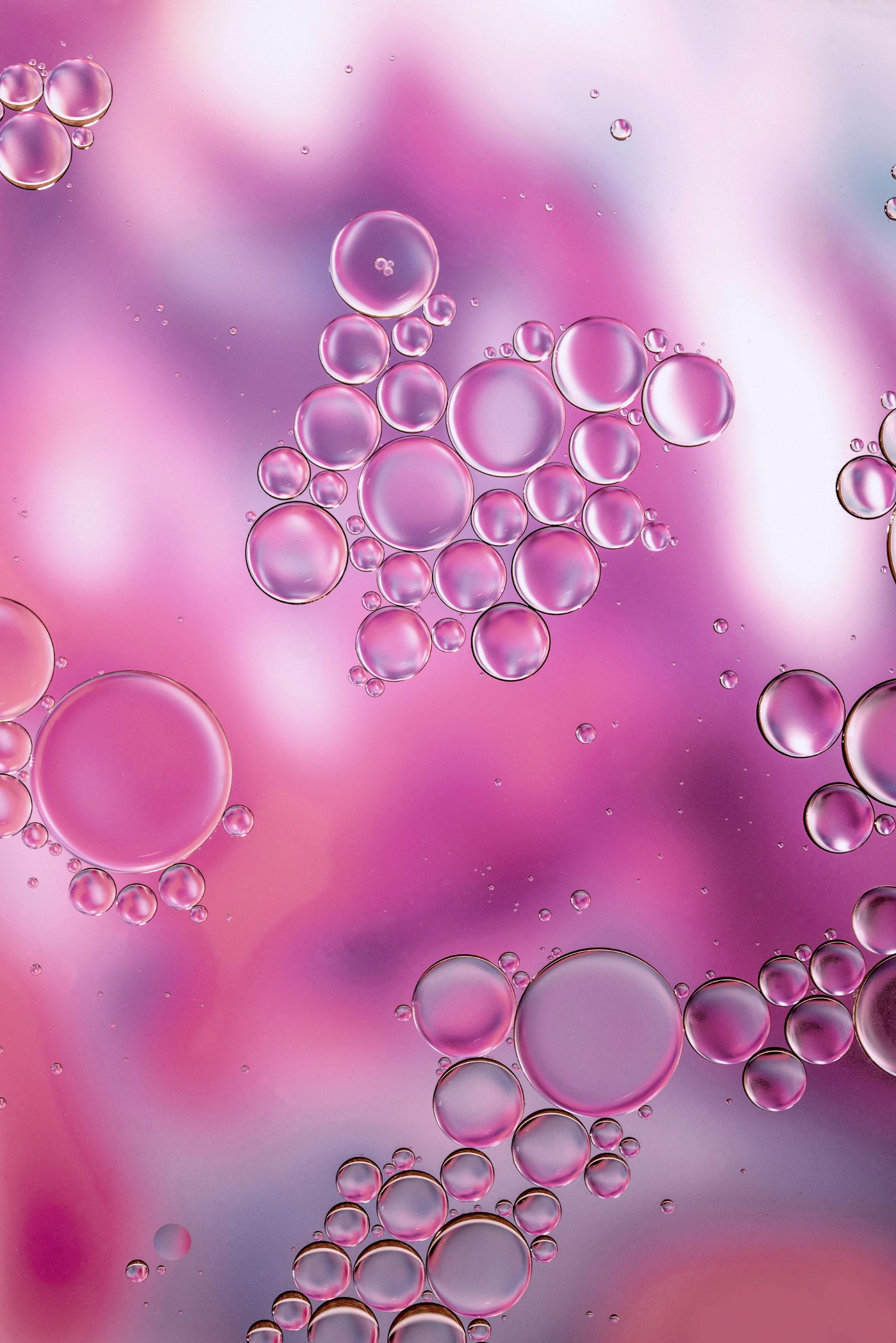 "Immiscible 6". Oil drops on water, with a background acrylic pour painting done by my sister Laya Clode and my mother Sian Butler. This photo is about more subtle and paler pastel tints. Please see the tutorial on the page "Oil and water photography" on my site Tracts4free.WordPress.com.