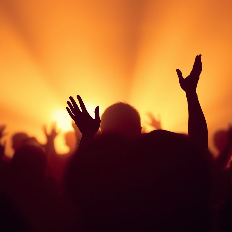 Silhouette of uplifted hands in worship