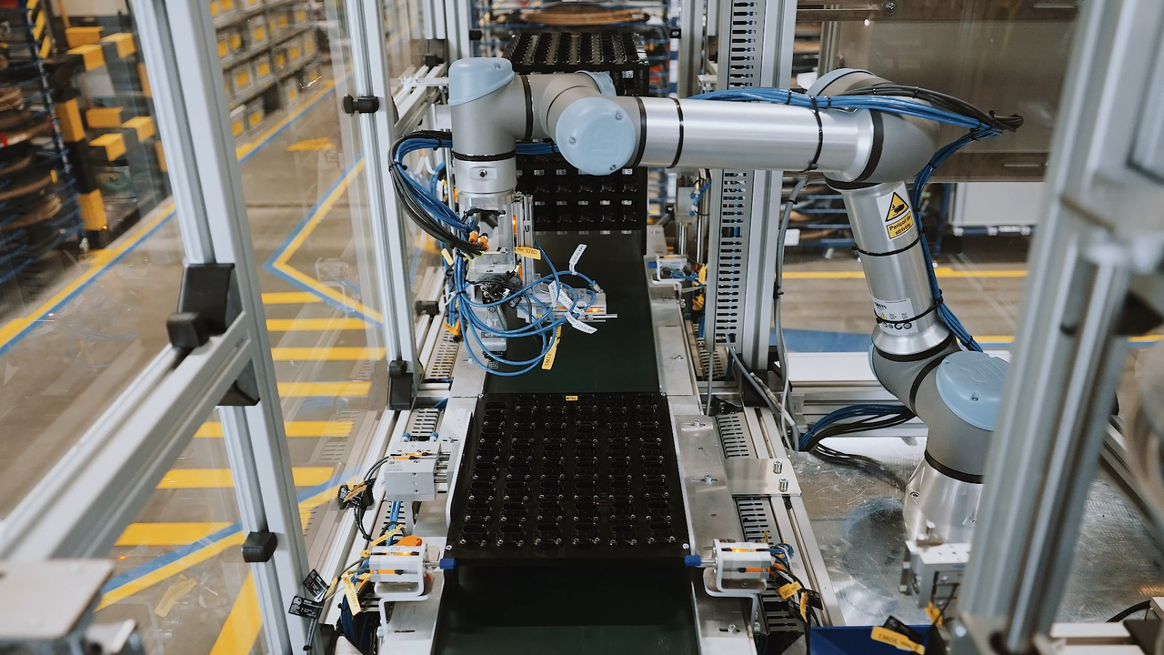 Integrating robotic arms into an assembly line