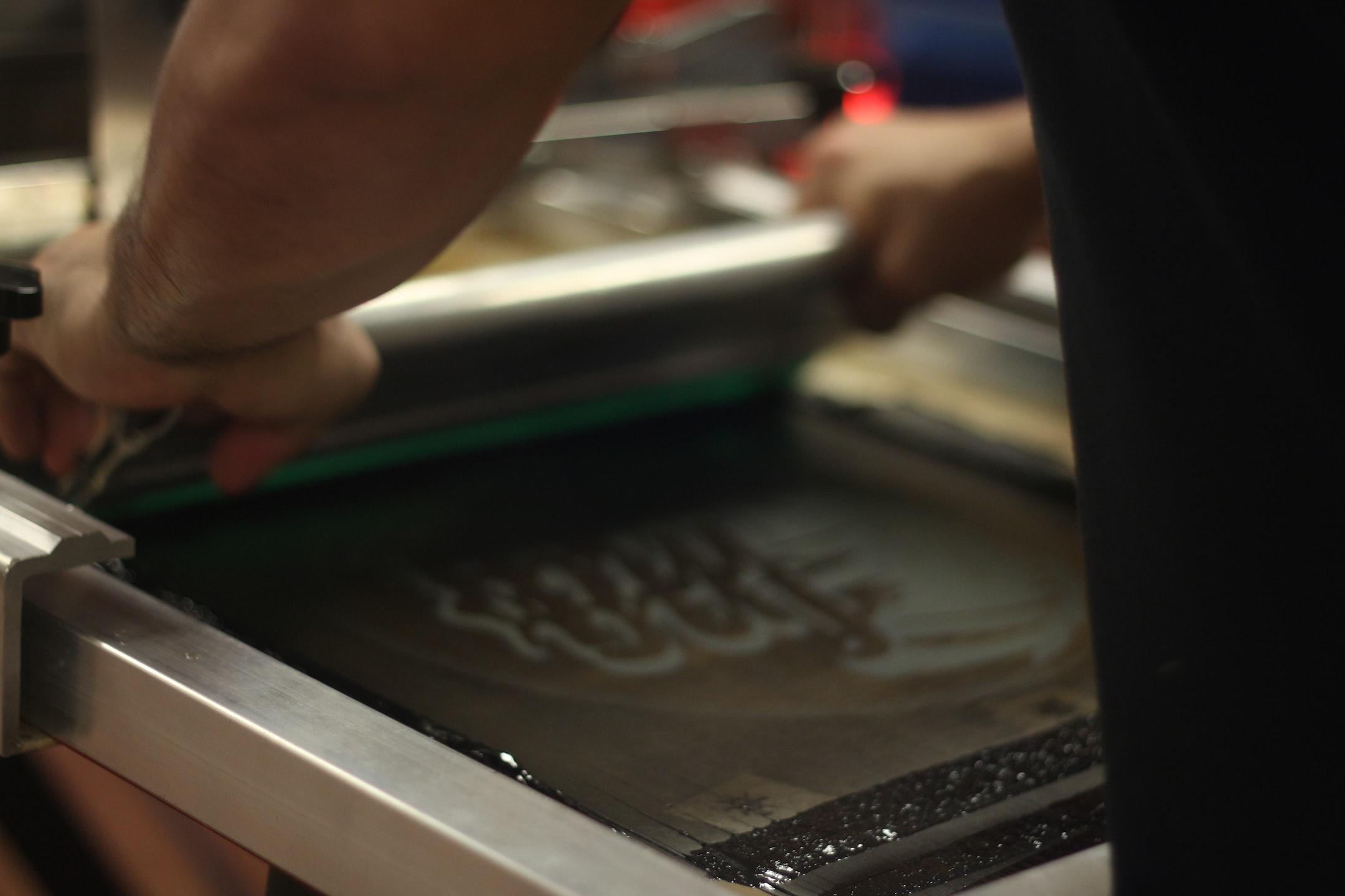 Image of someone at work at a Wisconsin screen printing company.