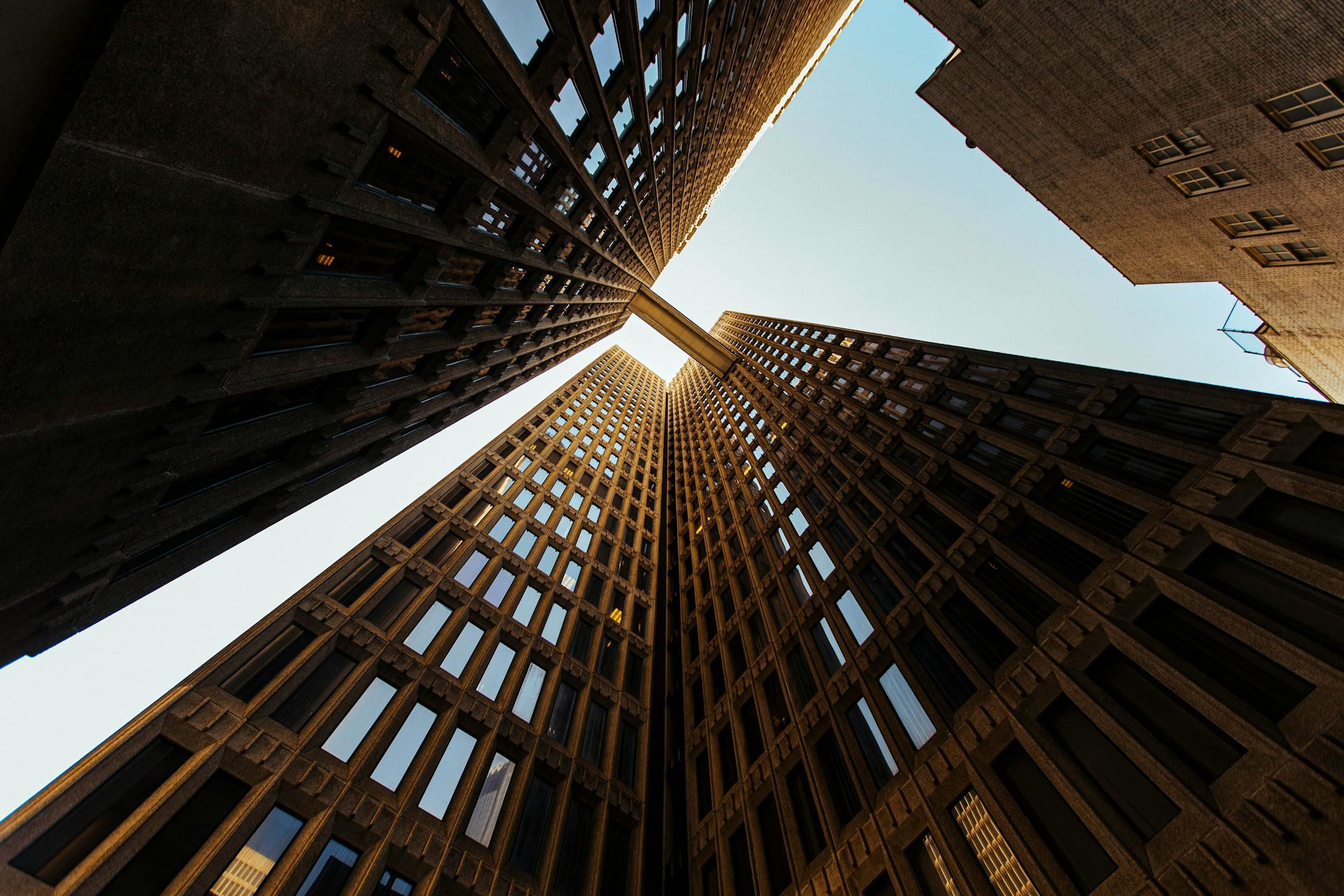 Low-angle view of skyscrapers in Atlanta, capturing the city's architectural essence against a clear sky.