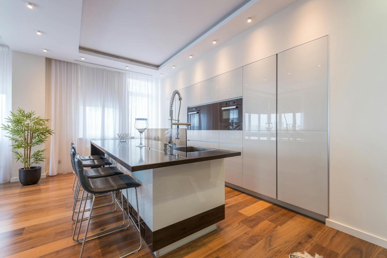 Spacious and contemporary open-plan kitchen with sleek fixtures.