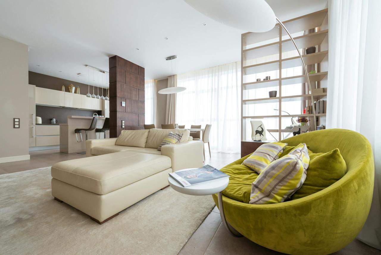 Spacious and stylish living room featuring modern furniture and elegant decor.