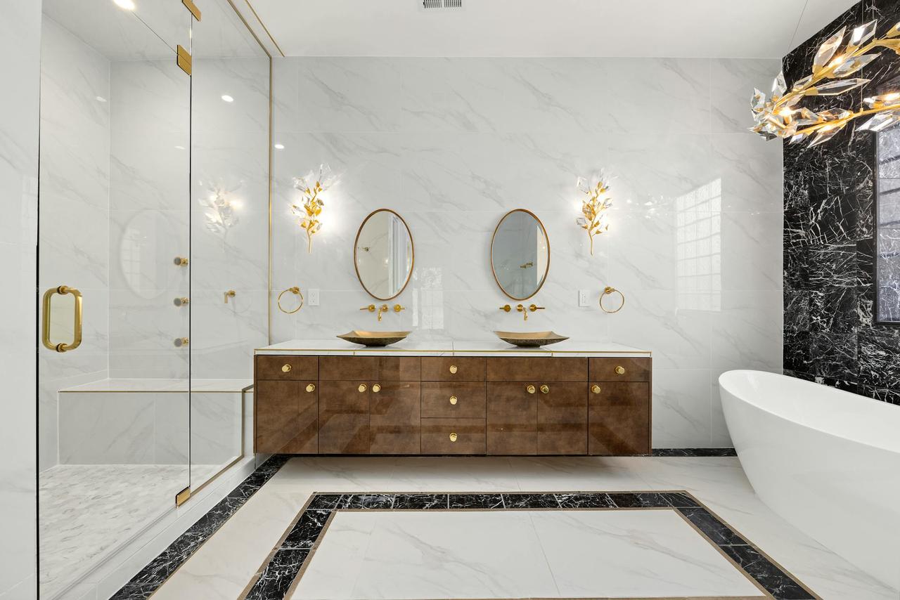 Elegant bathroom in Denver showcasing luxury marble and modern fixtures.