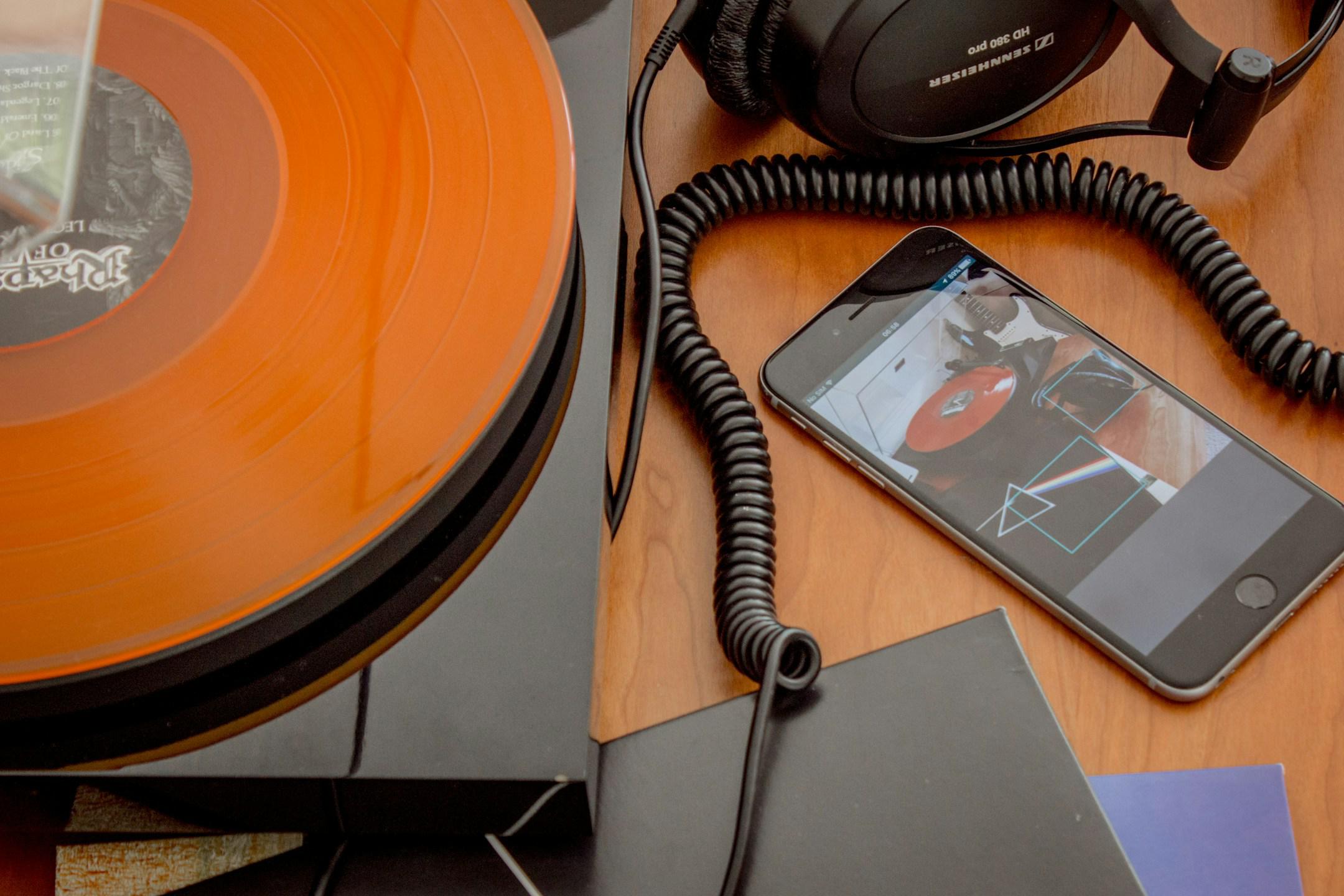 Vinyl record player, headphones, iPhone, records