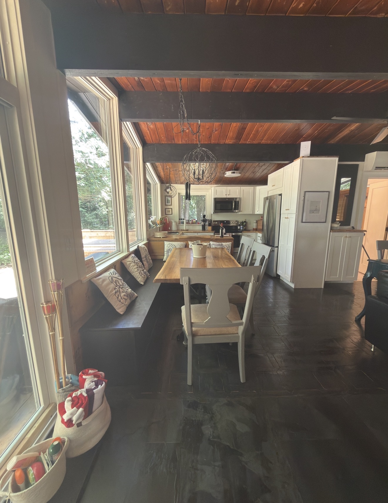 Bright kitchen and dining area with beamed ceiling