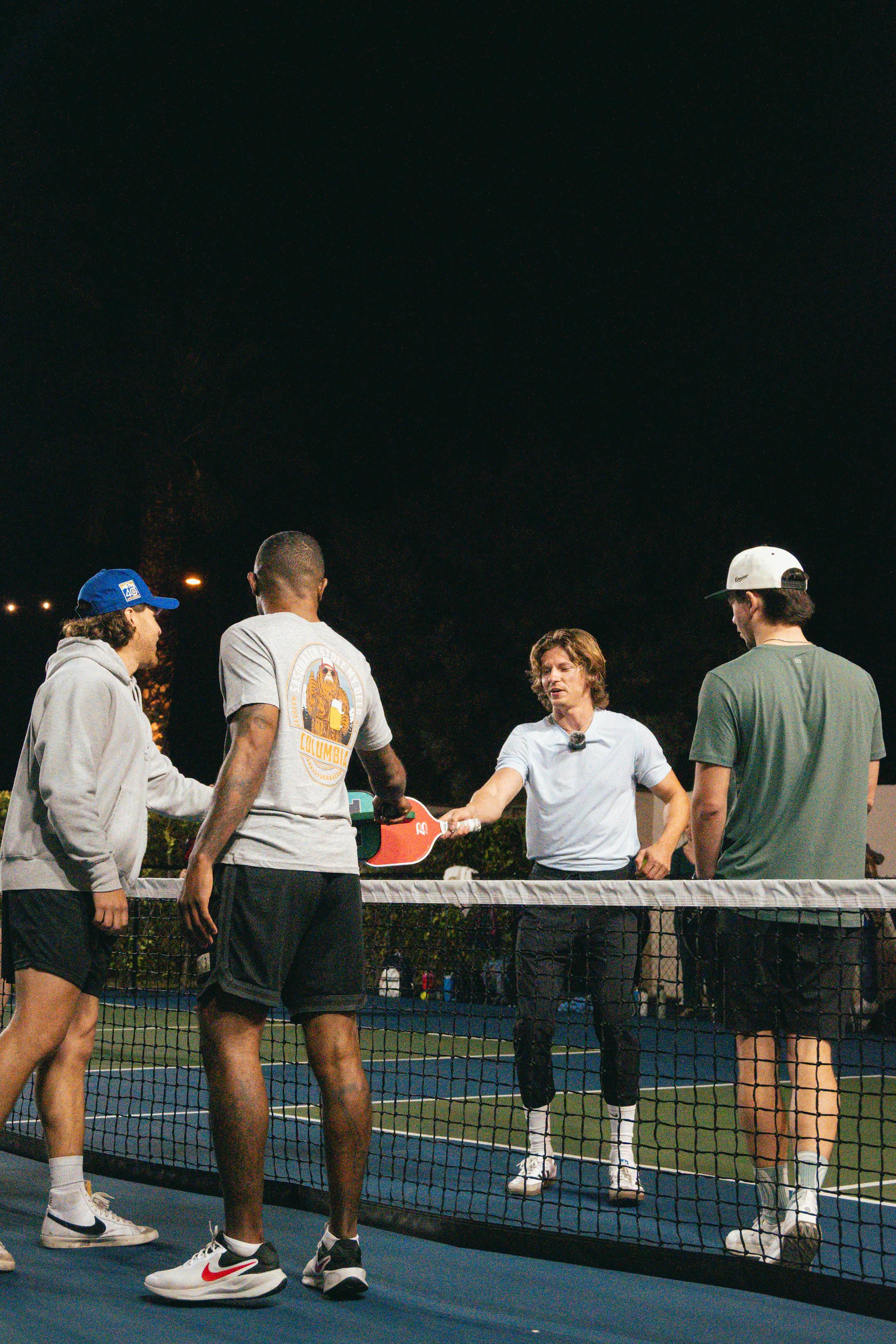 Group of friends enjoying a pickleball game on a Scottsdale night.
