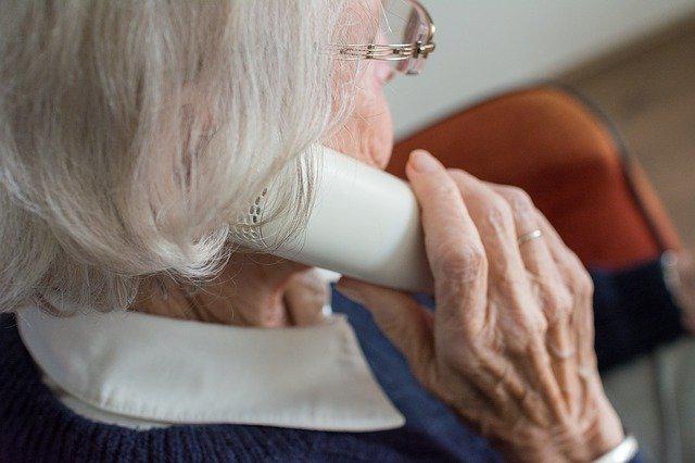 senior citizen speaking on the telephone