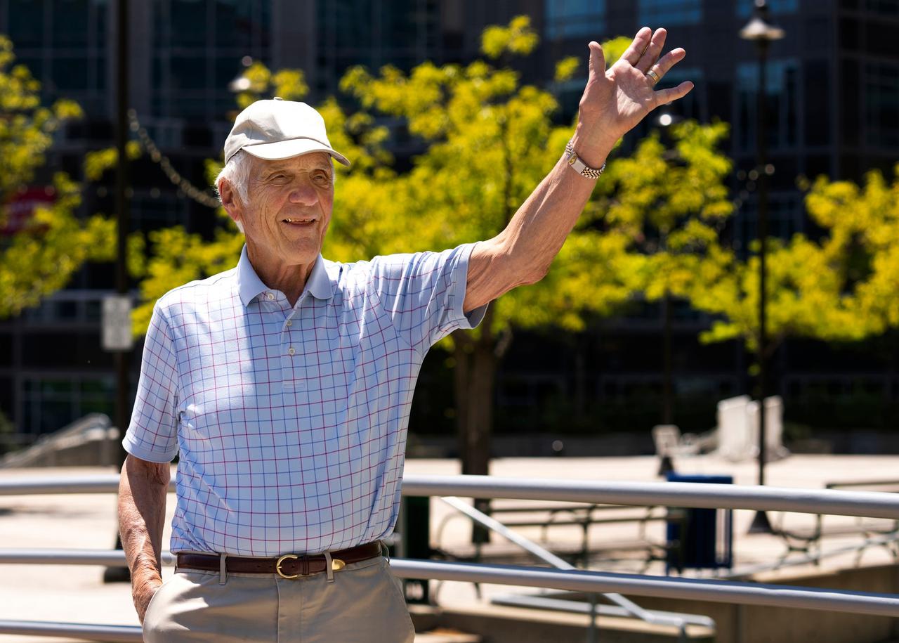 senior-man-waving-while-taking-walk-outdoors_23-2150579720.jpg