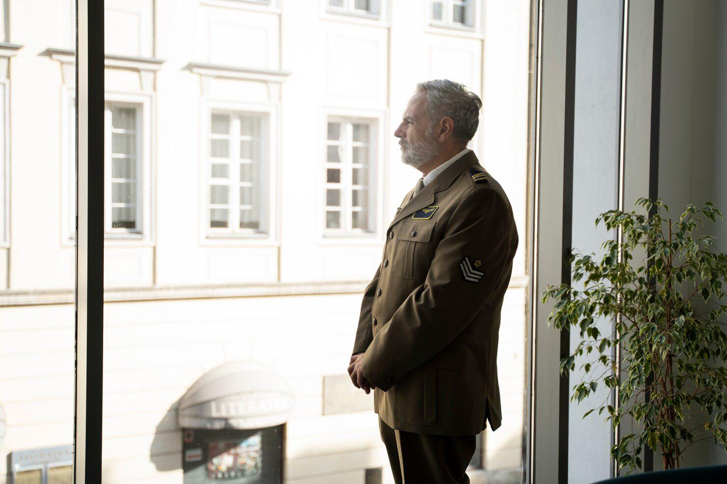 elderly-general-uniform-side-view_23-2149742911.jpg