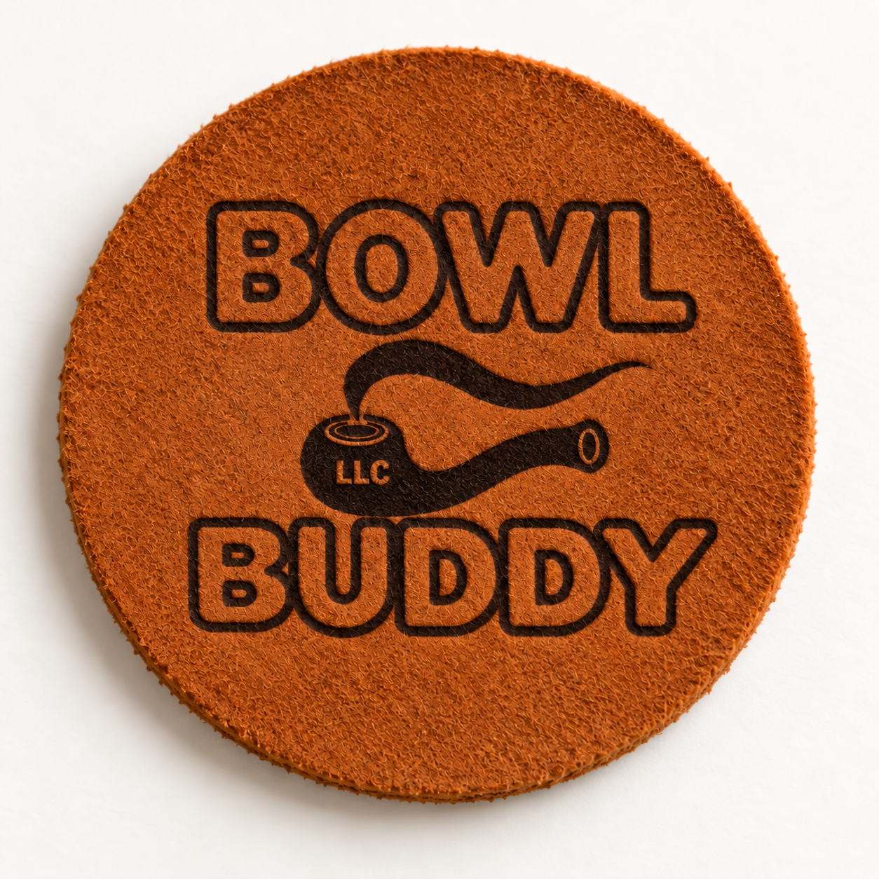 Bowl Buddy, a small circular piece of leather resting beside a pipe bowl