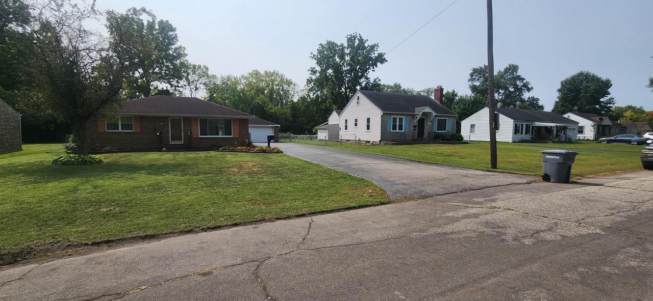 Affordable lawn care service in Indianapolis — freshly mowed front yard and trimmed edges by CasaLux Outdoor Solutions, your trusted budget-friendly lawn care company.”