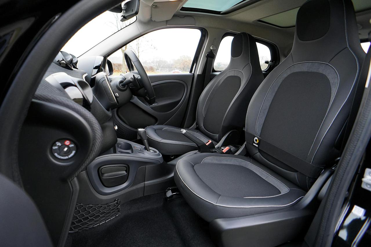 Explore the sleek interior of a modern luxury car featuring leather seats and advanced technology.