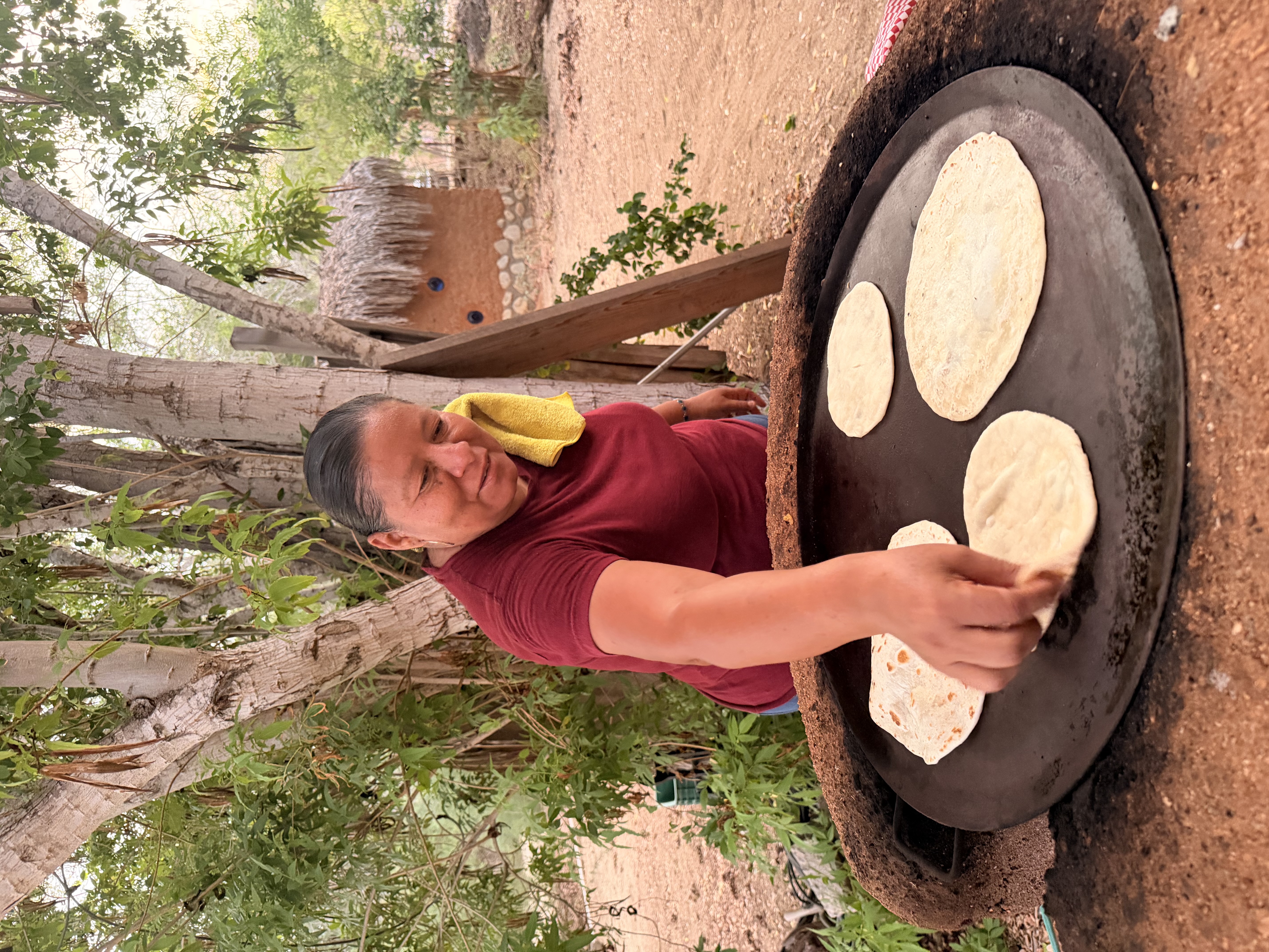 Traditional tortilla-making demonstration at Santiago oasis
