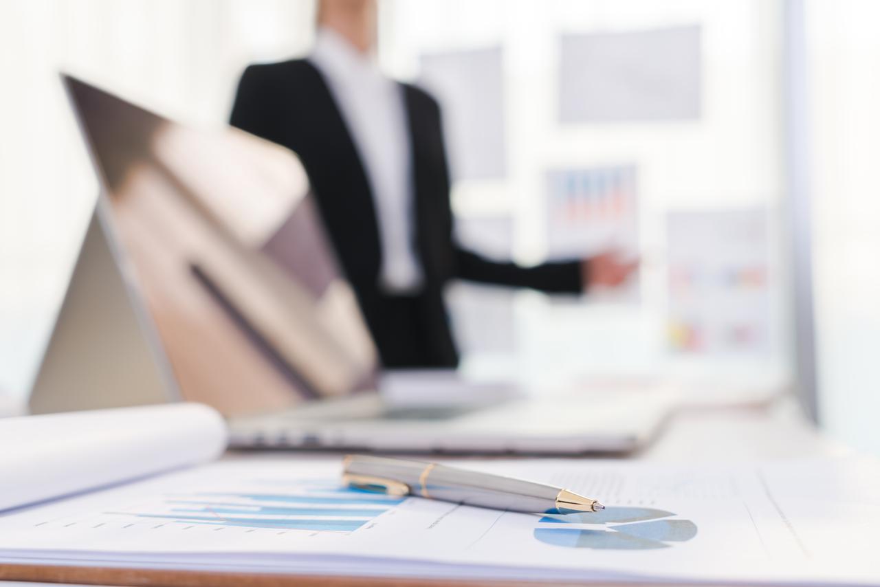 business-people-using-laptop-financial-charts-meeting-o.jpg