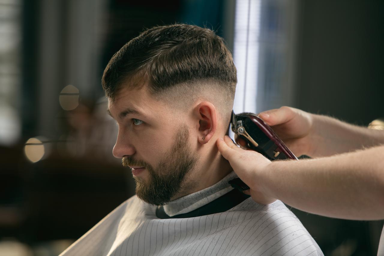 Expert barber providing professional haircut and beard grooming in Irving Texas