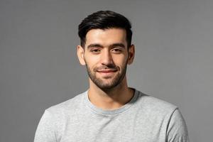 close-up-portrait-of-smiling-handsome-young-caucasian-man-face-looking-at-camera-on-isolated-light-gray-studio-background-photo.jpg
