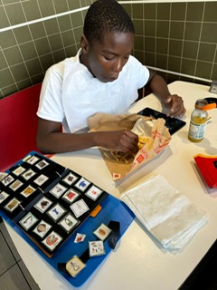 Young person learning communication skills with support in a real environment
