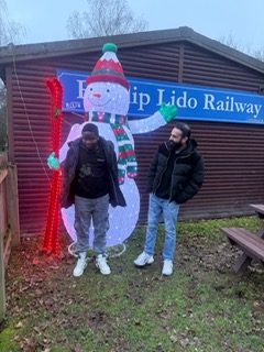 Two people enjoying a community outing together at a local venue