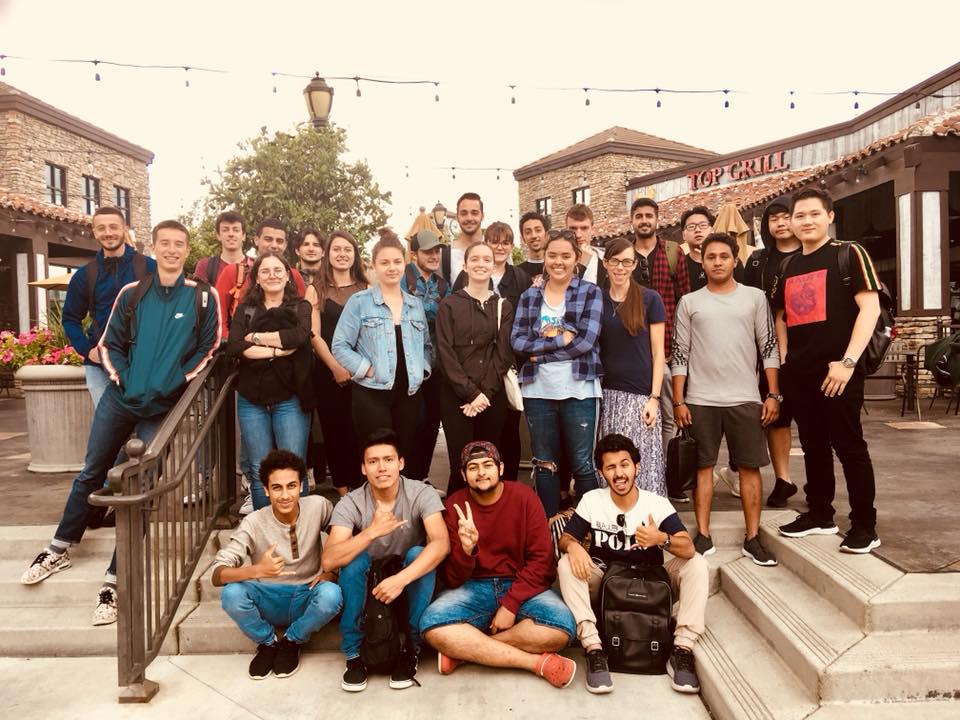 A class photo at a mall. Our English classes in Riverdale are more than just a place to learn. They're a place to forge friendships that last a lifetime!