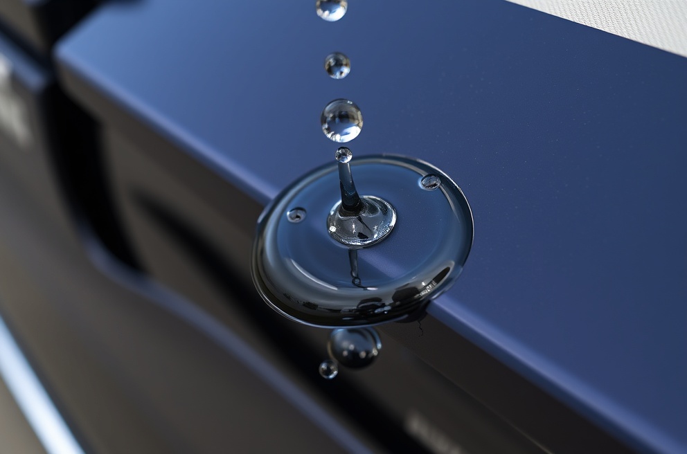 Professional ceramic coating showing water repellent properties on RV surface