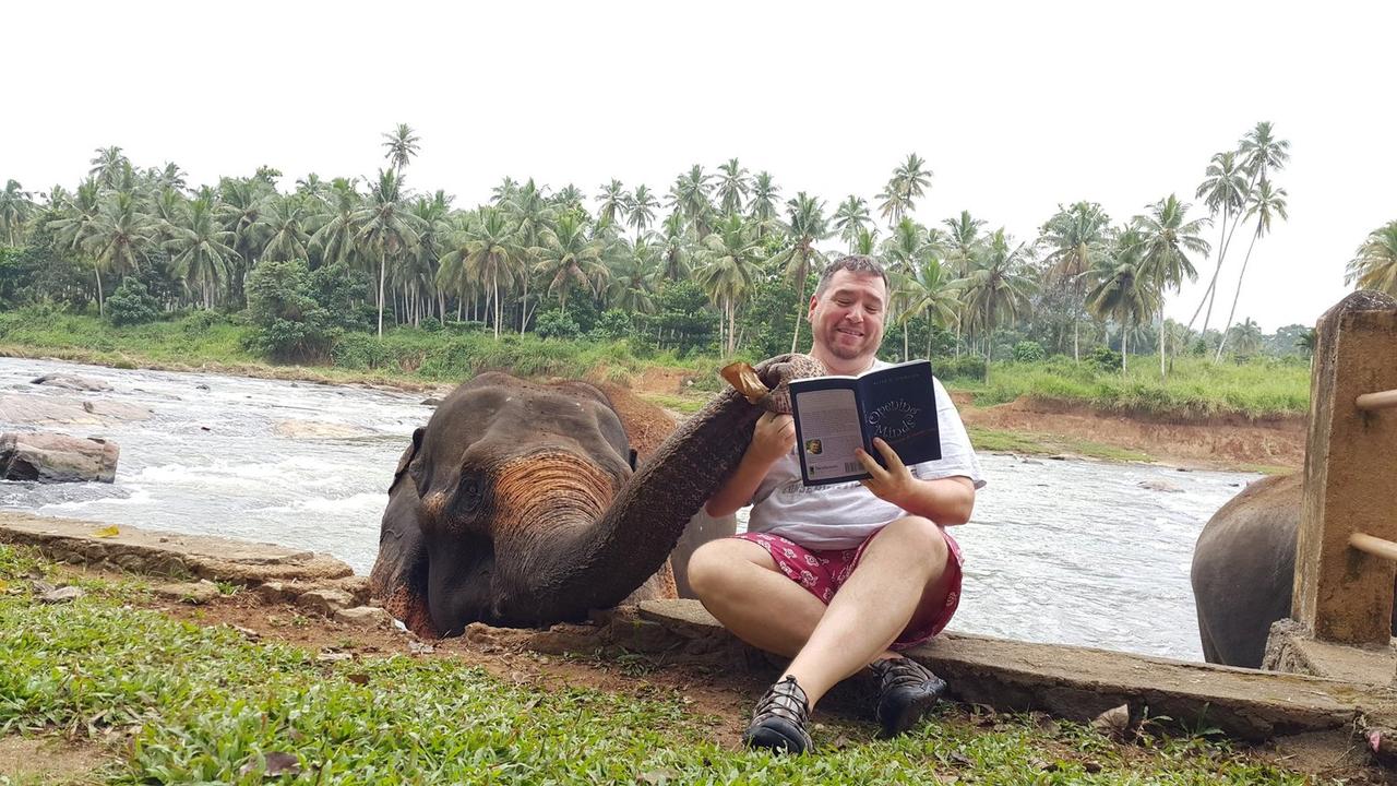 mike read to elephant.jpeg