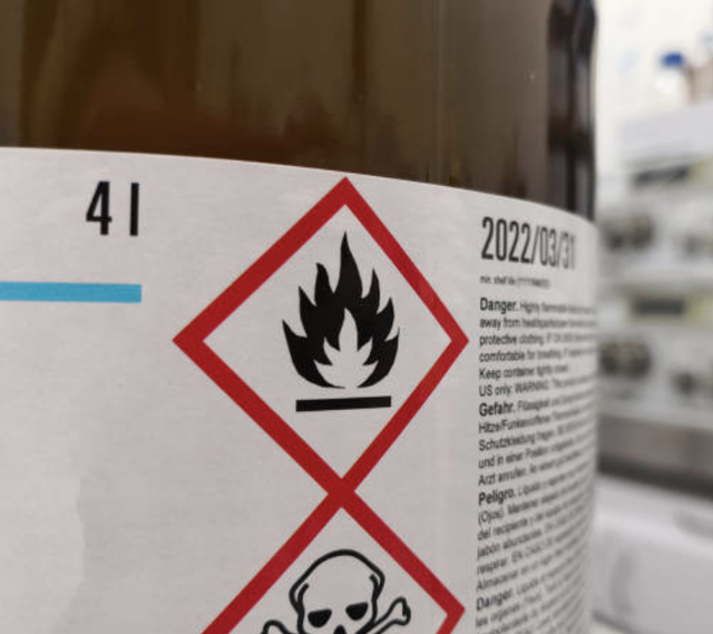 A label signaling hazardous material. Understanding the importance of labeling is just the beginning of what a shipping consultant will help you with.