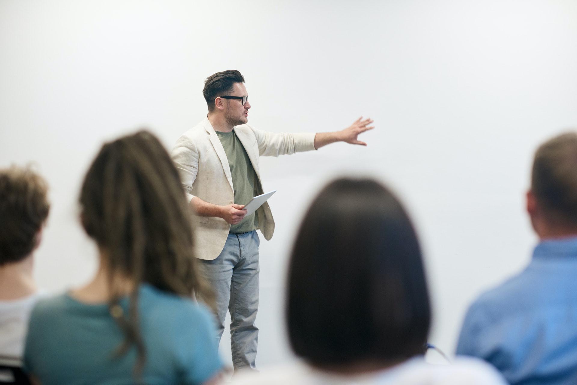 Instructor pointing to a whiteboard