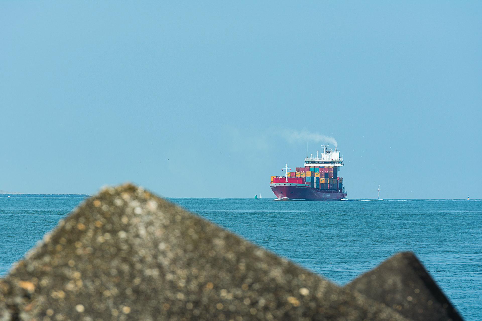 Ship with containers on the horizon