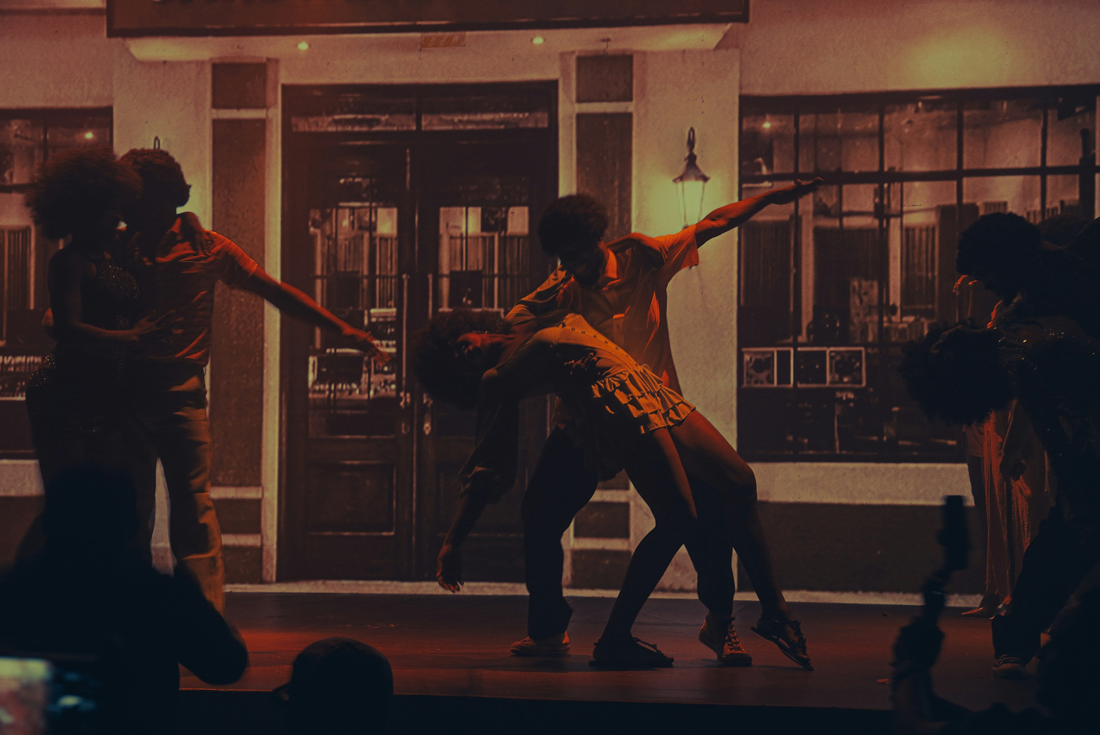 Multiple dancers performing on a stage