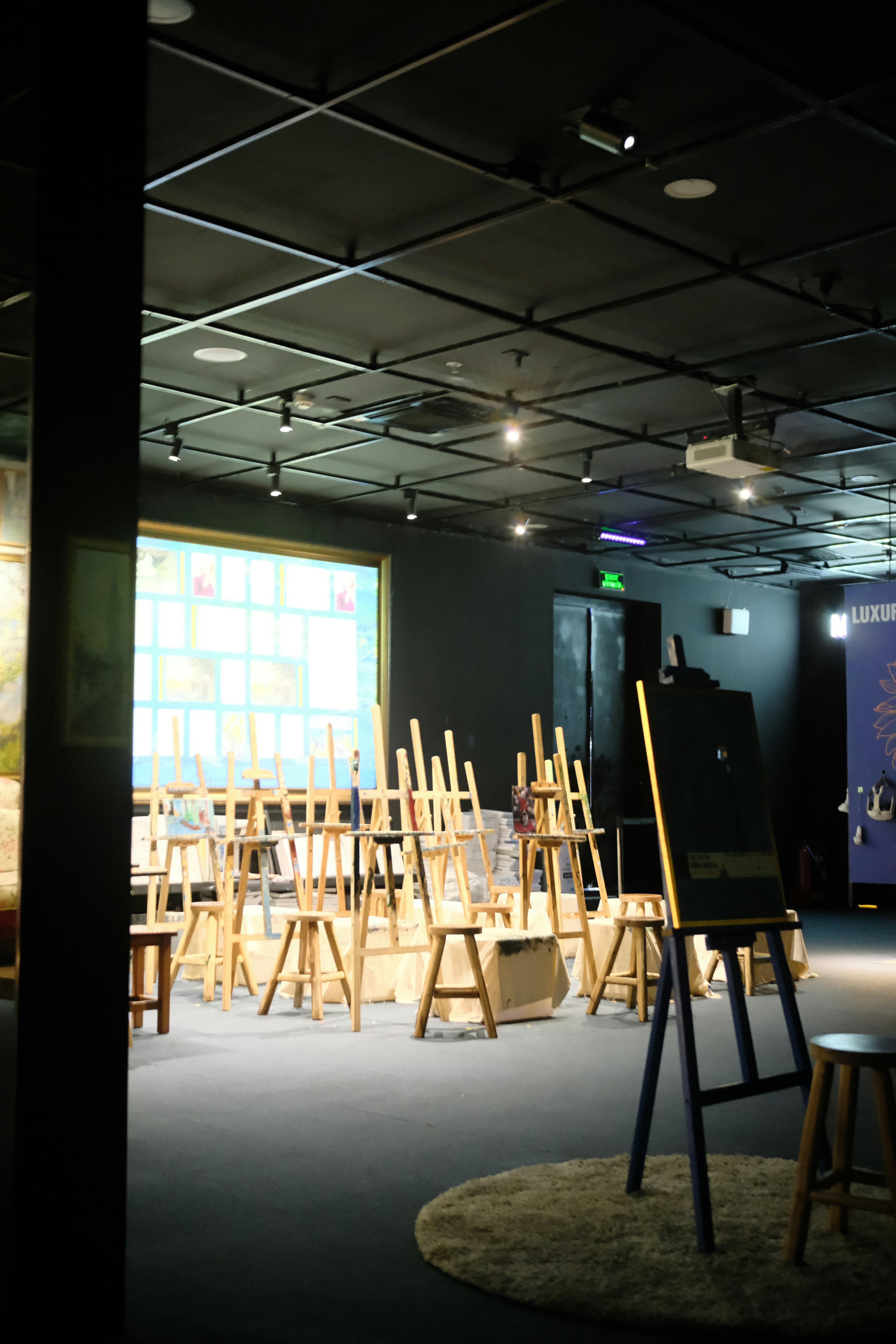 Art studio with easels and paintings