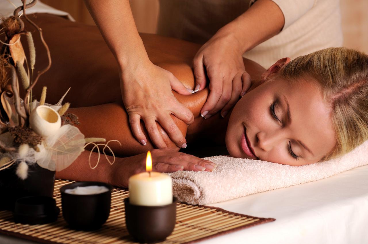 masseur-doing-massage-female-shoulder-beauty-salon.jpg