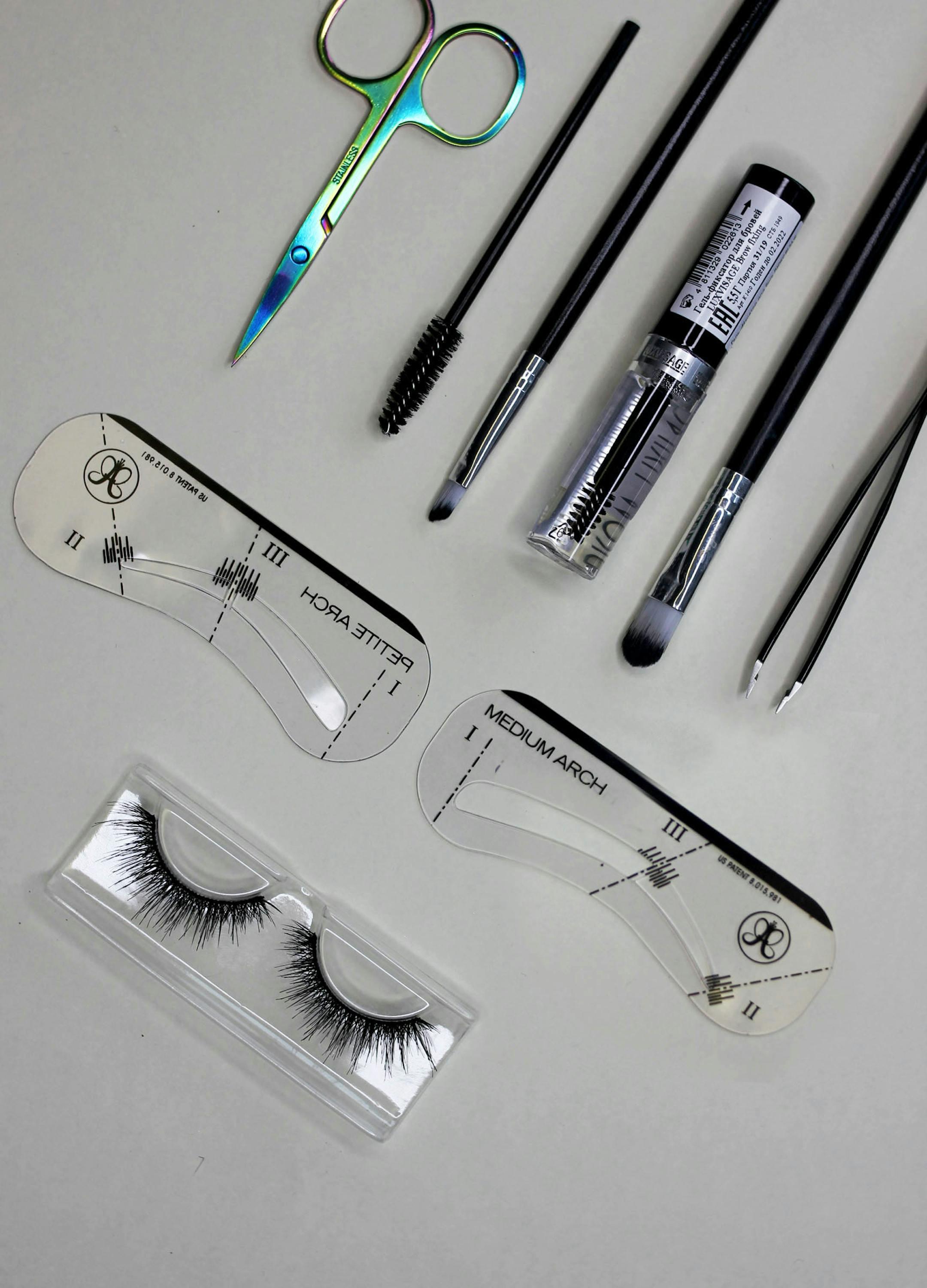 A collection of essential makeup tools for achieving perfectly shaped eyebrows.