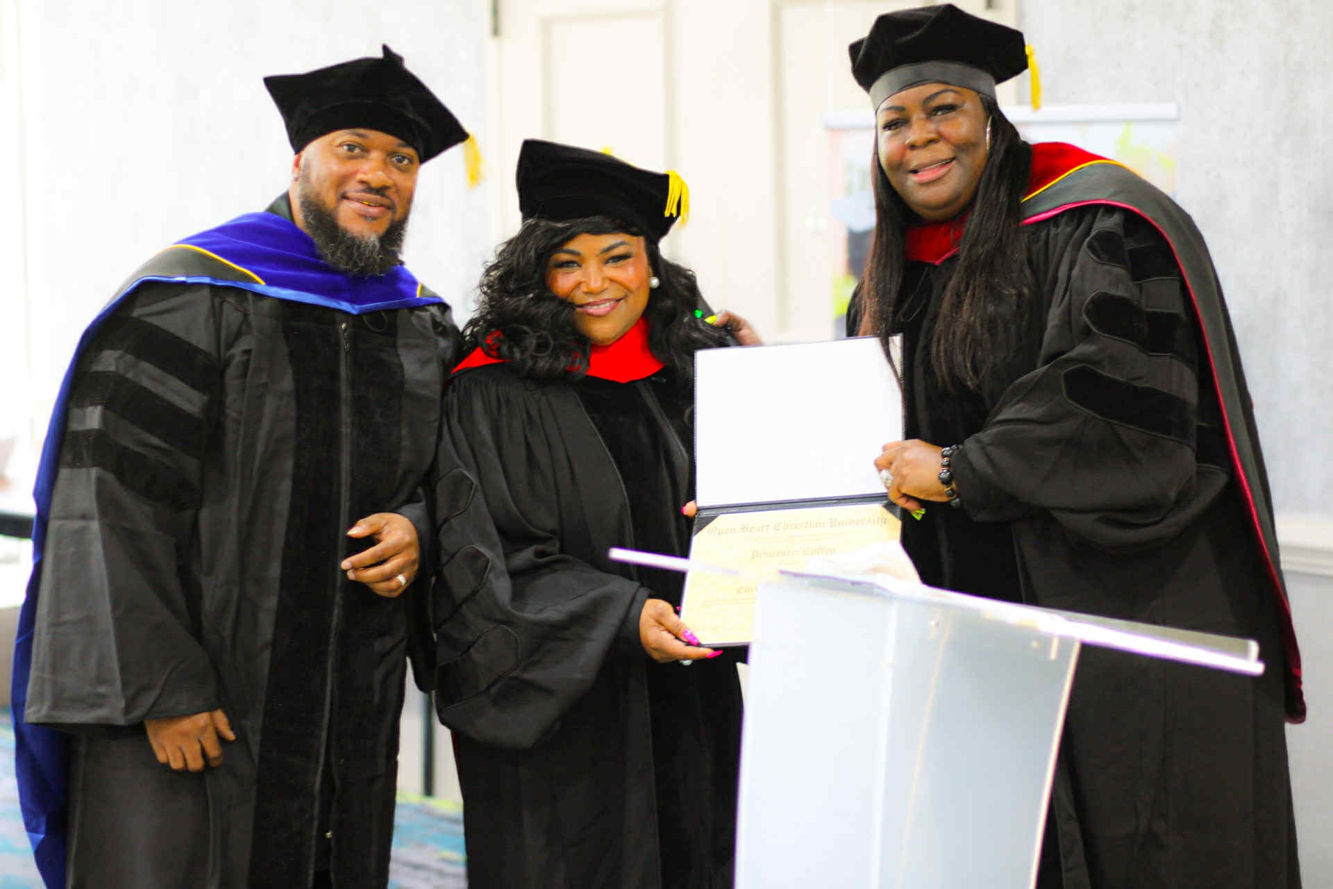 University chapel interior with rows of wooden benches and prominent cross