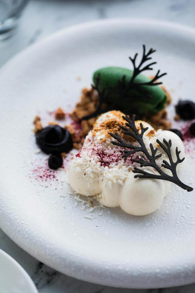 Elegant Michelin-starred restaurant table setting with fine cuisine and wine, designed for luxury travelers.