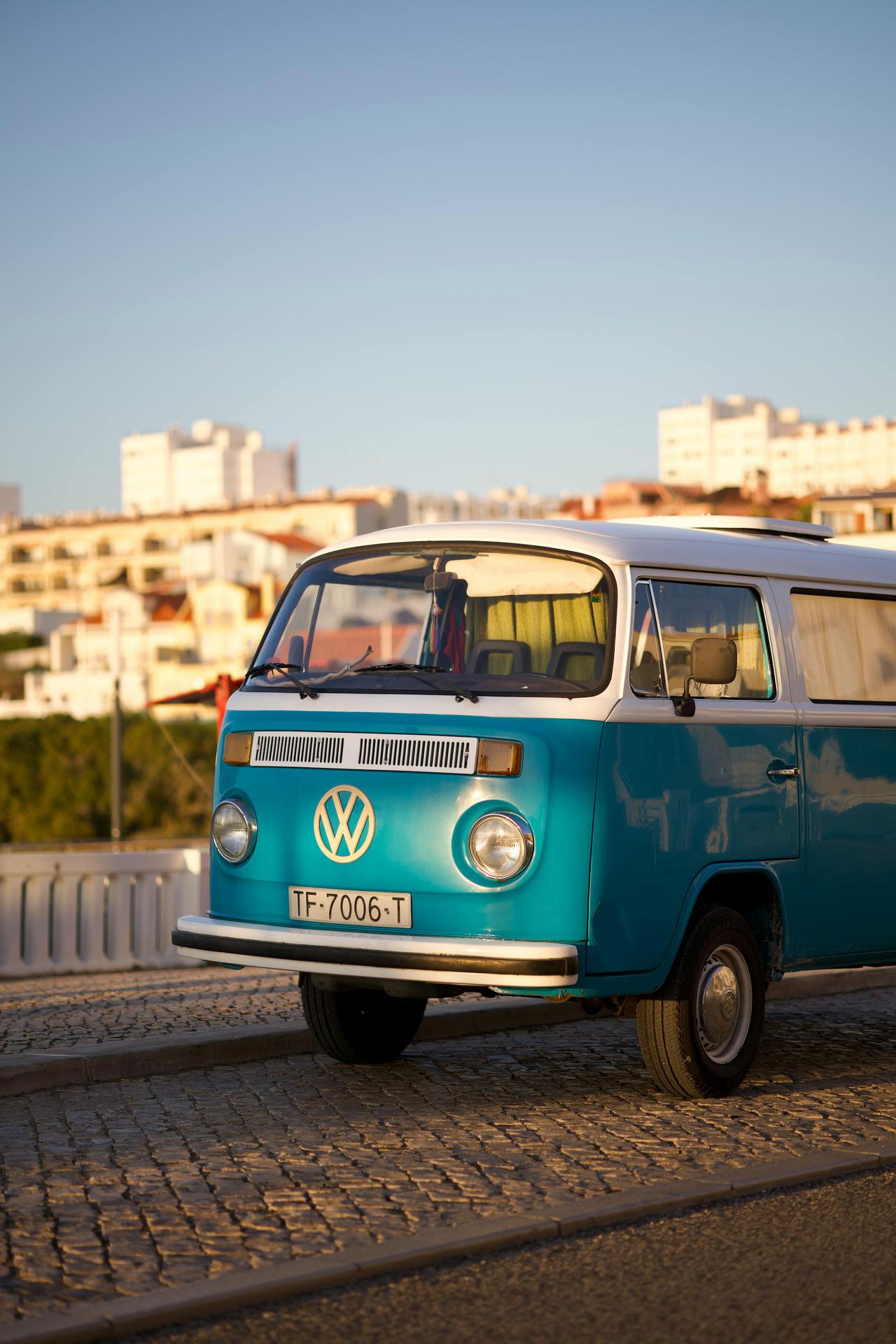 A classic blue Volkswagen van parked in Torres Vedras, Lisbon, Portugal on a sunny day.