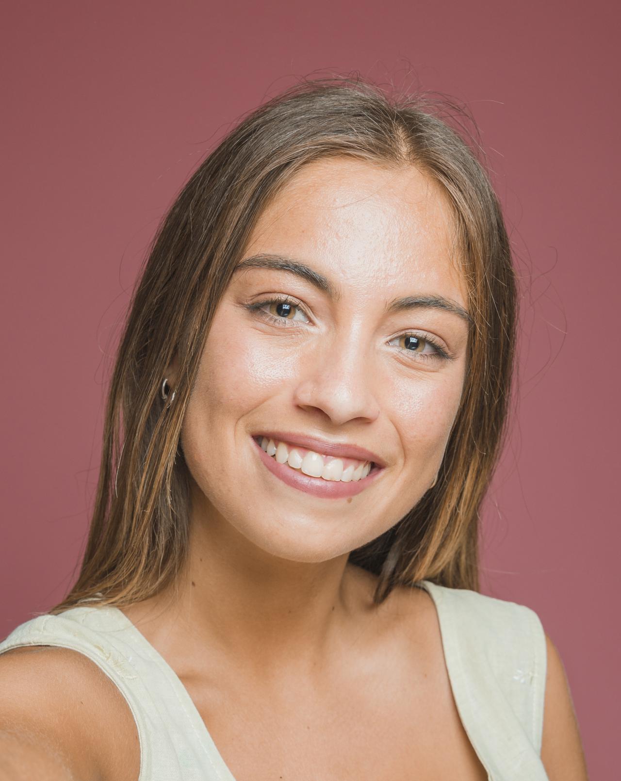 portrait-beautiful-smiling-young-woman-against-colored-background.jpg