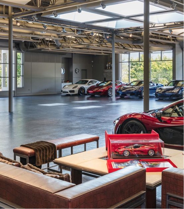 Luxury dream garage with glass doors and luxury car
