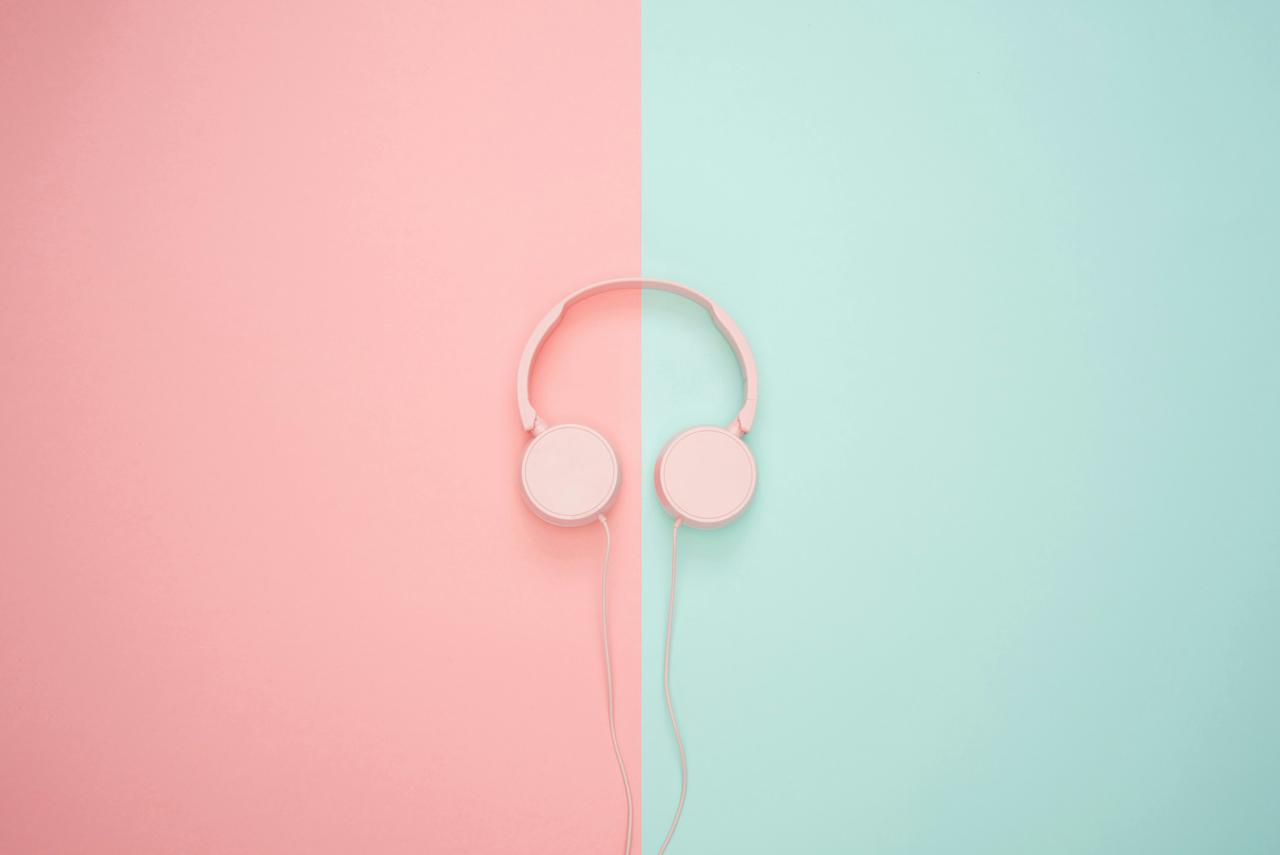 Pink headphones on a pastel background